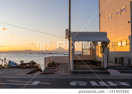 A sunset view of the coast with the Manase bus stop in Hayama town and Mount Fuji in the background. A sunset view of the coast with the Manase bus stop in Hayama town and Mount Fuji in the background. 141405888