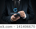 Businessman hand using smartphone with virtual password reset icon. Concept of changing password, account recovery, security update, and cyber hygiene. 141406670