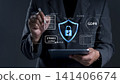 Businessman using tablet with ISO 27001 certified and GDPR compliance interface icons. Concept of information security management system ISMS, data protection policy, corporate regulatory standard. 141406674