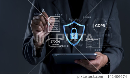 Businessman using tablet with ISO 27001 certified and GDPR compliance interface icons. Concept of information security management system ISMS, data protection policy, corporate regulatory standard. Businessman using tablet with ISO 27001 certified and GDPR compliance interface icons. Concept of information security management system ISMS, data protection policy, corporate regulatory standard. 141406674