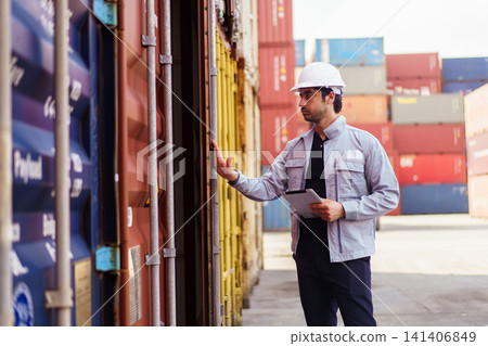 Logistics worker checking shipping container with digital tablet Logistics worker checking shipping container with digital tablet 141406849