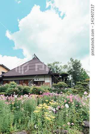 An old house and a beautiful garden An old house and a beautiful garden 141407237