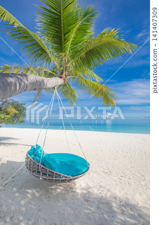 Rope swing palm tree white sand beach turquoise water tropical island resort shore. summer vacation travel honeymoon paradise seascape coastline outdoors getaway scene Rope swing palm tree white sand beach turquoise water tropical island resort shore. summer vacation travel honeymoon paradise seascape coastline outdoors getaway scene 141407309