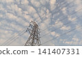 high voltage pole with clouds 141407331