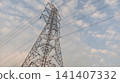 high voltage pole with clouds 141407332