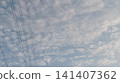barbed wire fence with blue sky 141407362