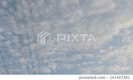 barbed wire fence with blue sky 141407362