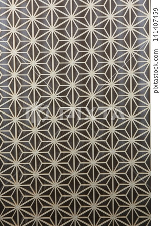 Traditional Japanese woodworking technique: Kumiko latticework, geometric patterns in wooden decoration, traditional Japanese craft, background material. Traditional Japanese woodworking technique: Kumiko latticework, geometric patterns in wooden decoration, traditional Japanese craft, background material. 141407459