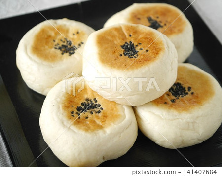 Flat-baked sweet bean paste bun Flat-baked sweet bean paste bun 141407684