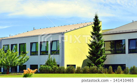 Eco building in modern city concept. Fresh green trees and office building, business concept. 141410465