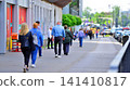 Warsaw, Poland. 20 May 2026. People walking on busy city street on a sunny summer day. Views of people against the background of buildings. City life, urban landscape. 141410817