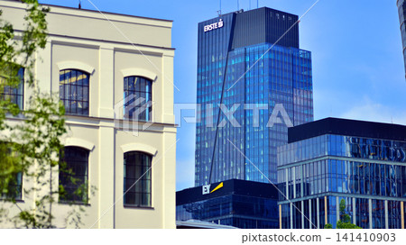 Warsaw, Poland. 20 May 2026. Urban landscape. Neon sign with the inscription: Erste and EY. Roundabout Daszynski. Skyscrapers in the financial district of downtown Warsaw. Warsaw, Poland. 20 May 2026. Urban landscape. Neon sign with the inscription: Erste and EY. Roundabout Daszynski. Skyscrapers in the financial district of downtown Warsaw. 141410903