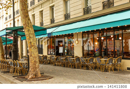 Traditional Paris street cafe with empty outdoor seating, inviting tourists and locals to enjoy the European dining experience 141411808