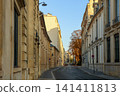 Paris street in the Latin Quarter at sunset, historic buildings creating a classic European urban landscape 141411813