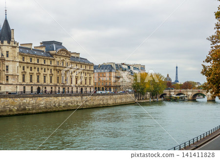 Conciergerie and Seine river embankment in Paris showing Pont Neuf and Eiffel Tower in distance Conciergerie and Seine river embankment in Paris showing Pont Neuf and Eiffel Tower in distance 141411828