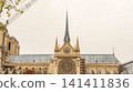 Notre Dame de Paris cathedral in France undergoing restoration, featuring the reconstructed spire and gothic architecture 141411836