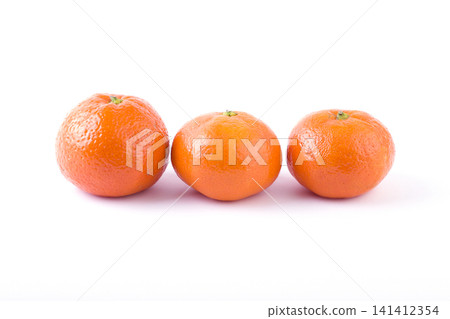 fresh mandarines isolated on white background. Oranges are arranged in rows. Placed on a white background. fresh mandarines isolated on white background. Oranges are arranged in rows. Placed on a white background. 141412354