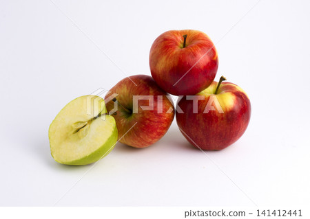 Apples on a white background. A group of apples on an isolated white background. Fruits on a white background. Apples on a white background. A group of apples on an isolated white background. Fruits on a white background. 141412441