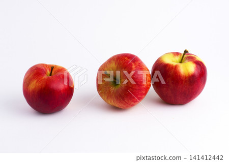 Apples on a white background. A group of apples on an isolated white background. Fruits on a white background. Apples on a white background. A group of apples on an isolated white background. Fruits on a white background. 141412442