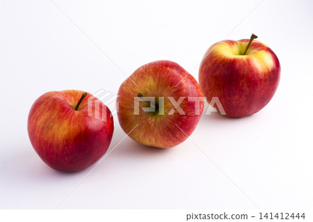 Apples on a white background. A group of apples on an isolated white background. Fruits on a white background. Apples on a white background. A group of apples on an isolated white background. Fruits on a white background. 141412444