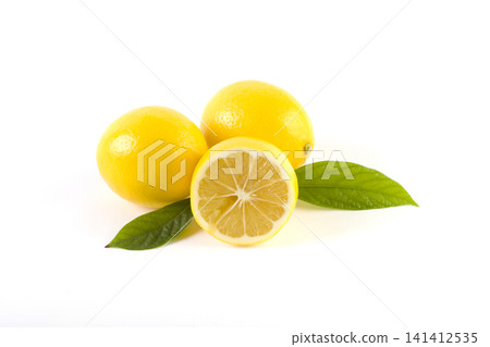Lemons with leaves on a white background. Fresh lemons on a white background. Lemons with leaves on a white background. Fresh lemons on a white background. 141412535