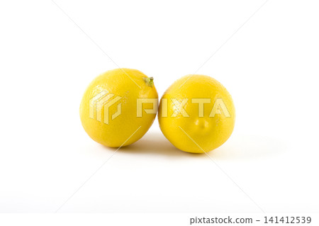 Lemons with leaves on a white background. Fresh lemons on a white background. Lemons with leaves on a white background. Fresh lemons on a white background. 141412539
