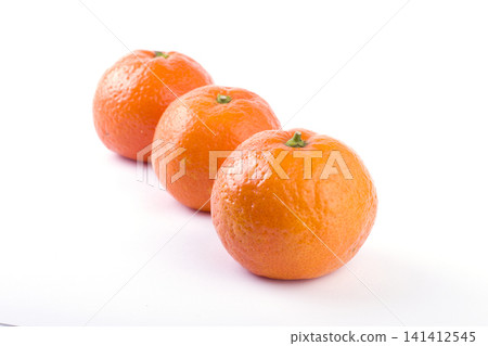 fresh mandarines isolated on white background. Oranges are arranged in rows. Placed on a white background. fresh mandarines isolated on white background. Oranges are arranged in rows. Placed on a white background. 141412545