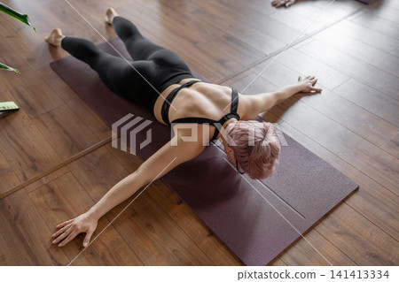 Peaceful yoga position for relaxation, gentle and relaxing yoga pose to ease tension and stress. Baby pose for lower back relaxation Peaceful yoga position for relaxation, gentle and relaxing yoga pose to ease tension and stress. Baby pose for lower back relaxation 141413334