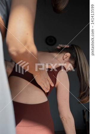 Woman doing mermaid exercise in a sunlite, modern pilates studio, embodying calm, focus, and strength Woman doing mermaid exercise in a sunlite, modern pilates studio, embodying calm, focus, and strength 141413599