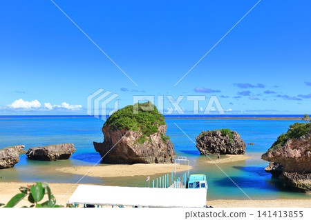 [Okinawa Prefecture] Mibaru Beach and rocky reef under a clear blue sky. 141413855