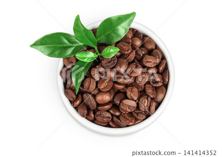 Coffee beans in ceramic bowl isolated on a white background. Top view Coffee beans in ceramic bowl isolated on a white background. Top view 141414352