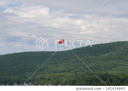 Parasailing Over Lake George in New York During a Summer Day Parasailing Over Lake George in New York During a Summer Day 141414843