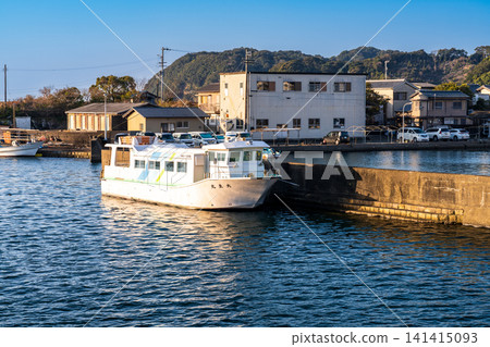 Mugi Port on an early spring morning, with the ship Taisei Maru 2 anchored there, Mugi-cho, Kaifu-gun, Tokushima Prefecture. Mugi Port on an early spring morning, with the ship Taisei Maru 2 anchored there, Mugi-cho, Kaifu-gun, Tokushima Prefecture. 141415093