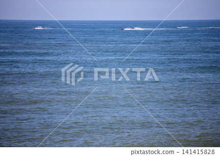 Jet skis speeding across the sea off Chigasaki and Hiratsuka Jet skis speeding across the sea off Chigasaki and Hiratsuka 141415828