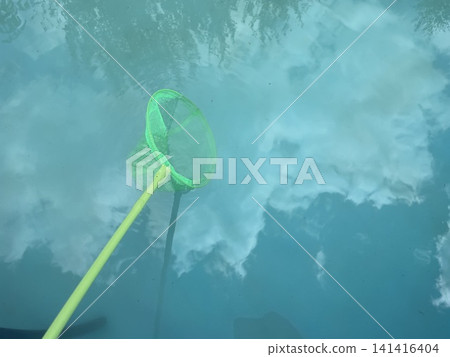 Pool skimmer net cleaning water surface Pool skimmer net cleaning water surface 141416404