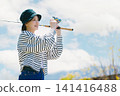 A young woman enjoying fishing as a hobby A young woman enjoying fishing as a hobby 141416488