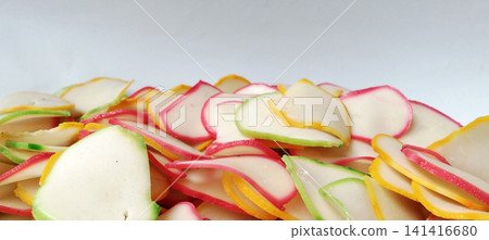Piles of colorful, uncooked Indonesian crackers Piles of colorful, uncooked Indonesian crackers 141416680
