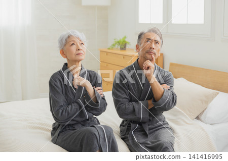 Senior couple in the bedroom Senior couple in the bedroom 141416995