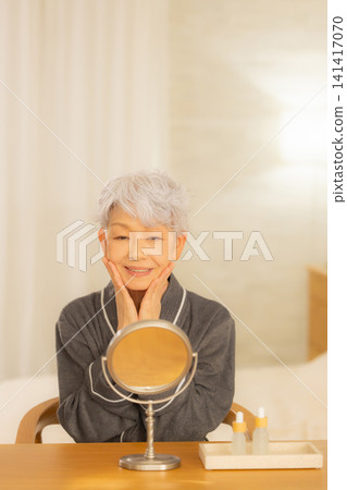Senior woman in a bathrobe Senior woman in a bathrobe 141417070