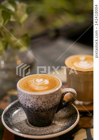 Latte coffee in ceramic cup on cafe table Latte coffee in ceramic cup on cafe table 141418004