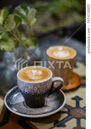 Latte coffee in ceramic cup on cafe table Latte coffee in ceramic cup on cafe table 141418005