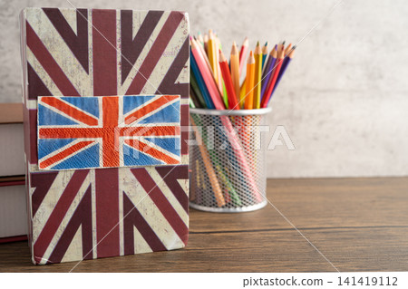 UK flag with graduate hat on english language book. 141419112