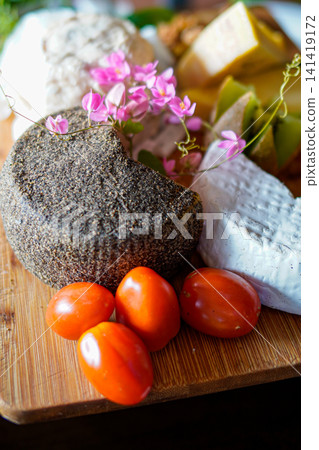 Premium Gourmet Cheese Assortment on Rustic Wooden Serving Board Premium Gourmet Cheese Assortment on Rustic Wooden Serving Board 141419172