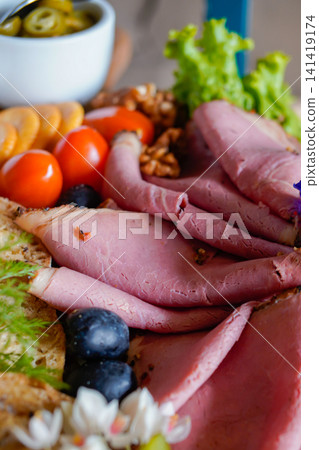 Premium Gourmet Roast Beef Charcuterie Board with Artisan Bread and Fresh Appetizers Premium Gourmet Roast Beef Charcuterie Board with Artisan Bread and Fresh Appetizers 141419174