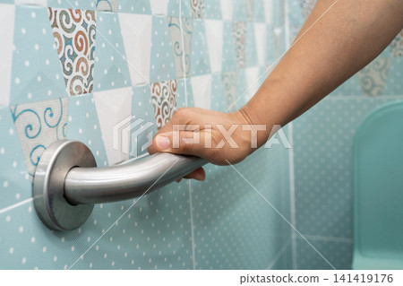 Asian elderly woman use toilet bathroom handle security, healthy strong medical. Asian elderly woman use toilet bathroom handle security, healthy strong medical. 141419176