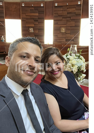 Couple dressed formally at a wedding or elegant event. UGC Couple dressed formally at a wedding or elegant event. UGC 141419991