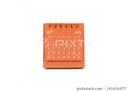 July 2027. Front view of mini desk calendar on white. July 2027. Front view of mini desk calendar on white. 141420477
