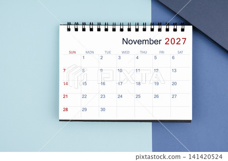 November 2027 monthly desk calendar for 2025 year on blue background. November 2027 monthly desk calendar for 2025 year on blue background. 141420524