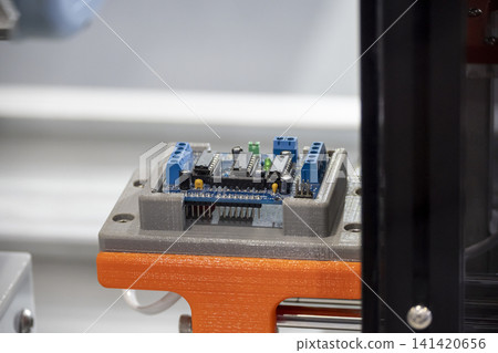 Close-up of 3D printing parts used as a custom assembly jig for the electronics parts manufacturing process. 141420656
