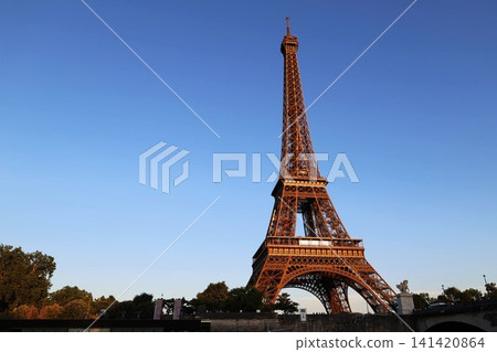 The Eiffel Tower in Paris, France, bathed in the morning sun. The Eiffel Tower in Paris, France, bathed in the morning sun. 141420864